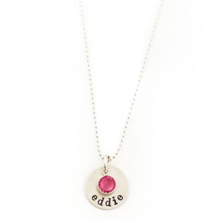 Sterling Silver Necklace with circle charm and name engraved. It has a birthstone attached.