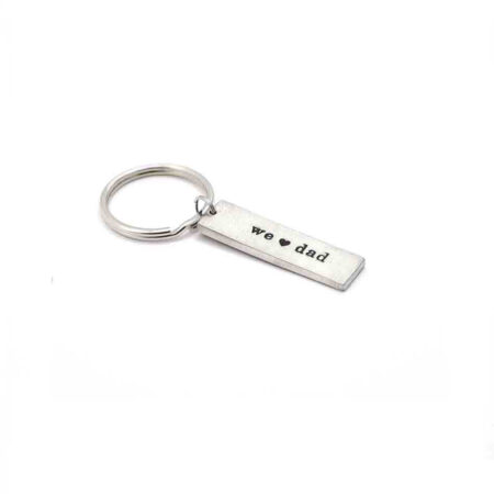 Made in fine pewter, hand-stamped with personalized words and hung on a keyring. Customize this with I or we heart dad, grandpa, papa, pops