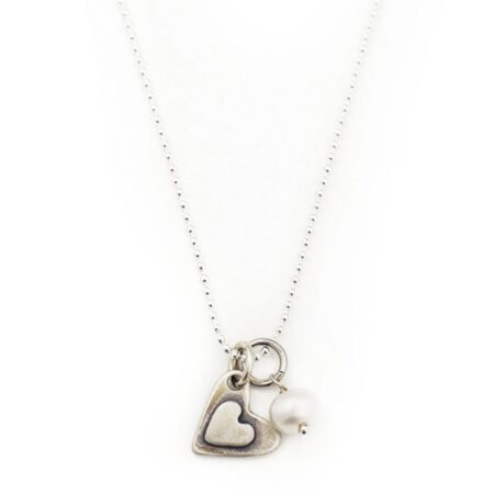 2 small sterling hearts layered with a simple message hand stamped “i love you more”. Perfect gift for wife, fiancee