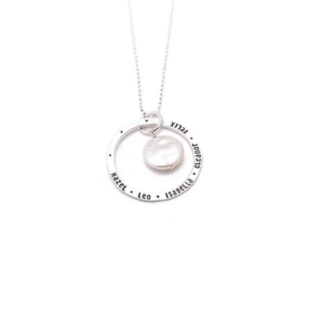 Classic Mother of Pearl necklace with a dainty sterling silver circle, hand stamped with names. Personalized jewelry for a mom