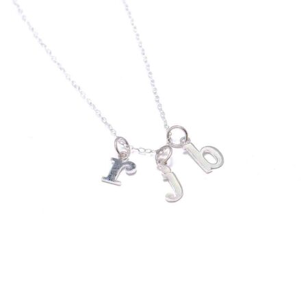 A dainty sterling silver necklace with lowercase typewriter initials. Perfect gift on family occasion or grandma, mom