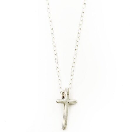 A small hand forged cross charm created with sterling silver and hung on a sterling chain. Perfect for girls of all ages.