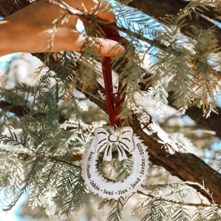 Family wreath ornament is made with quality pewter and topped off with a gorgeous freshwater pearl.